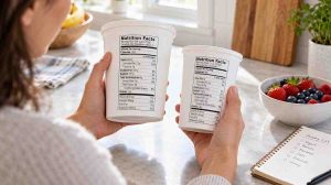 How to read protein on nutrition labels by comparing two yogurt containers and their serving sizes